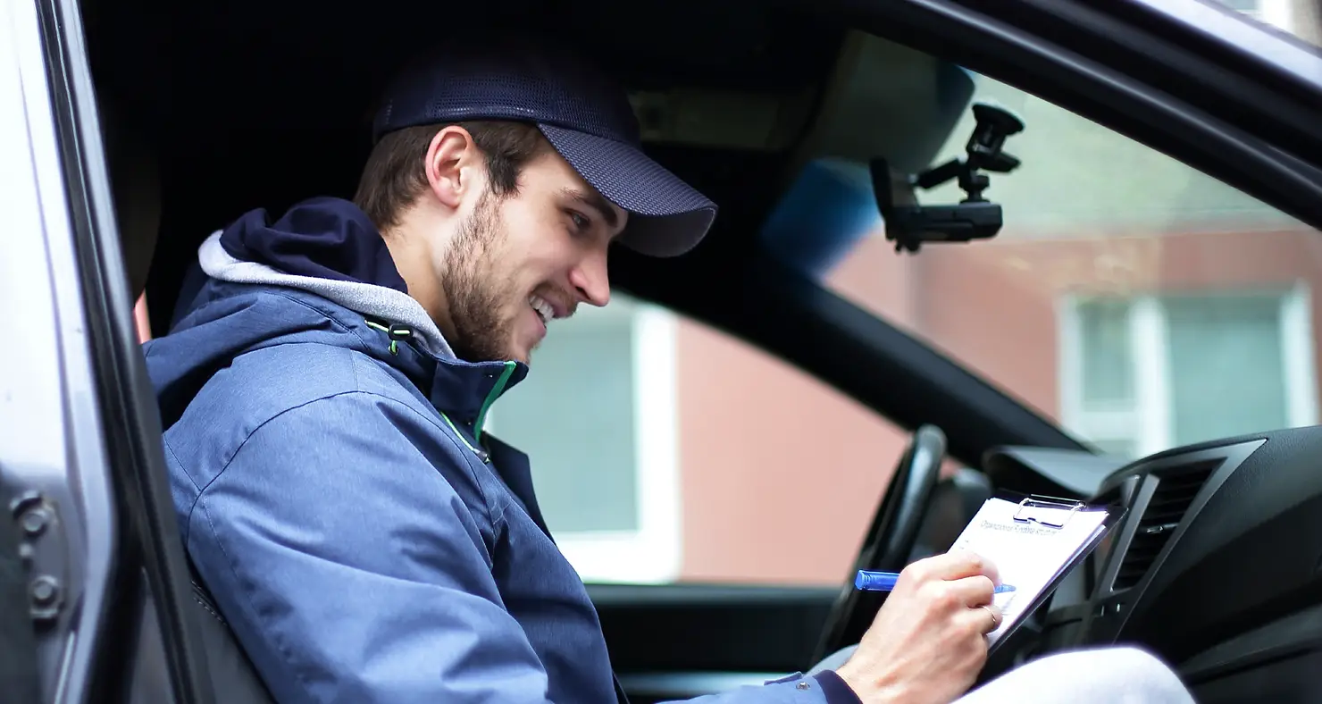 home inspector sitting inside the car